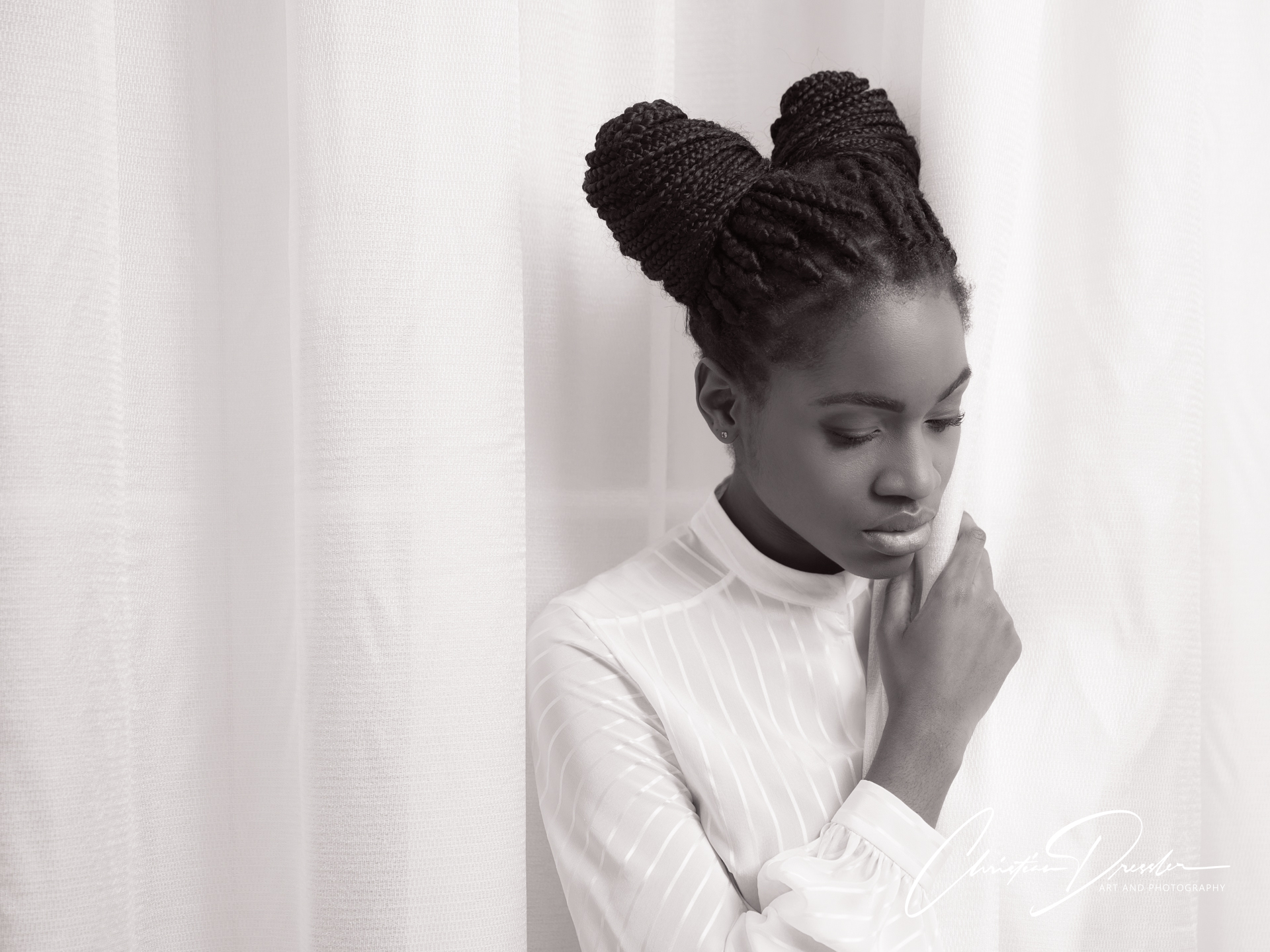 Black-and-white portrait of a woman by Christian Dressler